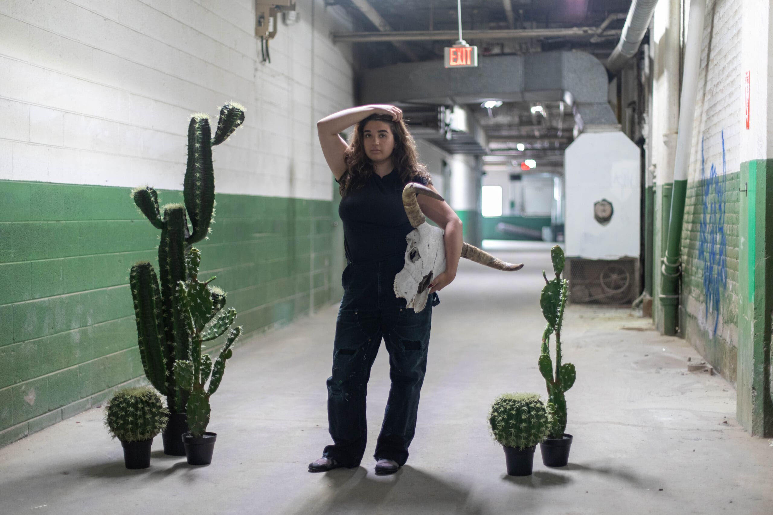 CCS 校友 Ilana Portney posing in the hallways of Detroit's Russell Center.