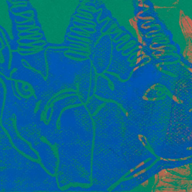 Abstract ink print of two antelopes. Blue ink on a green background.
