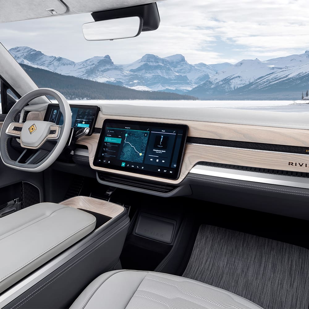 A photograph of a futuristic car showing the interior, dashboard, and steering wheel