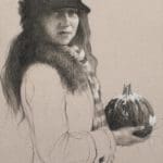 a woman wearing a jacket and felt hat holding a pumpkin