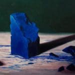 blue monolith with scattered fragments