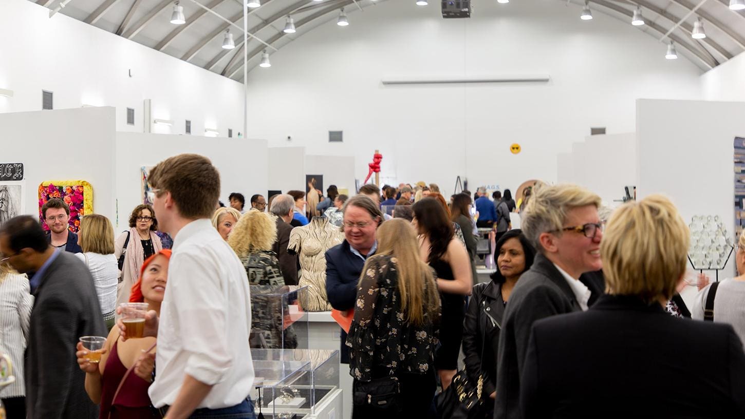 Crowd in an art gallery at the Taubman campus